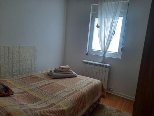 Ένα ή περισσότερα κρεβάτια σε δωμάτιο στο Sara apartman