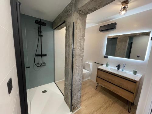 a bathroom with a sink and a shower at Villa Pejina in Laredo