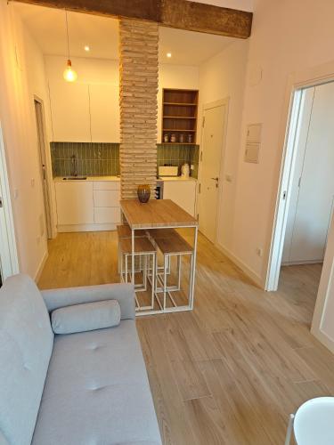 a living room with a couch and a table at Colón 29 Apartments in Denia