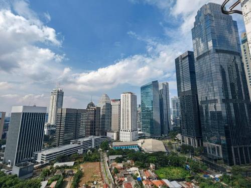 a view of a city with tall buildings at Senopati Penthouse Luxury 2 Bedroom Full Furnished SCBD Area in Jakarta