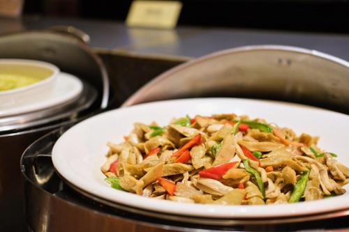 a white plate of food on a table at Yoai Hotel in Yilan City