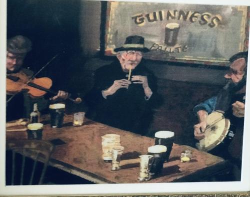 an old picture of a man with a pipe in a pub at No 14 Holiday Village House, Sneem, 4 bedrooms in Sneem