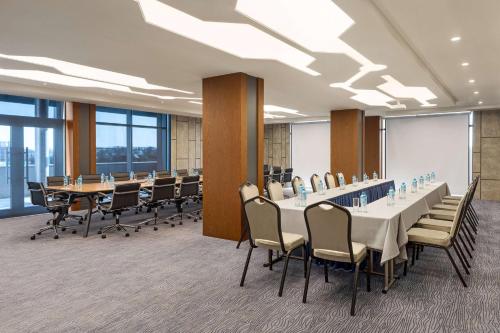 a conference room with a long table and chairs at Wyndham Garden Baku in Baku