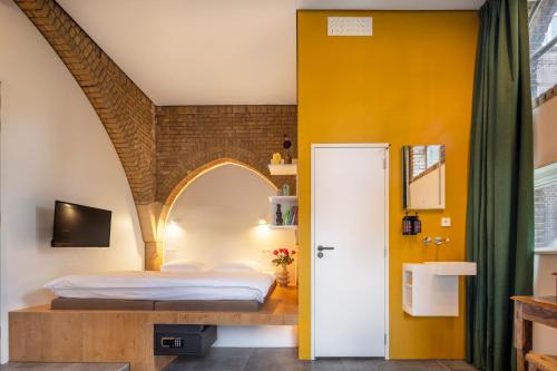 Кровать или кровати в номере Bunk Hotel Amsterdam