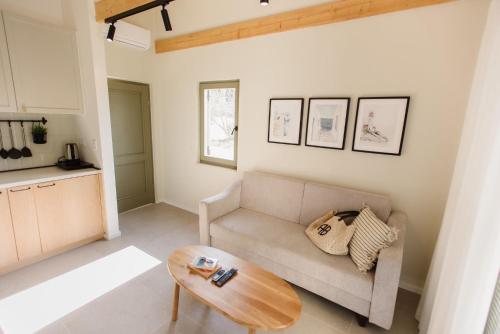 a living room with a couch and a table at Family Resort Urania in Baška Voda