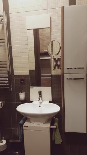 a bathroom with a white sink and a mirror at Home, far away from Home 2 in Budapest