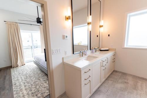 a bathroom with a sink and a mirror at Colony Suites in Palmer