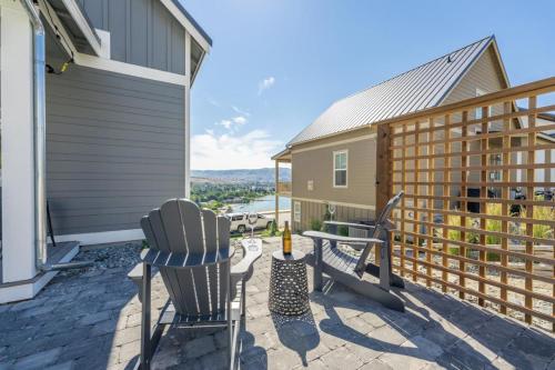a patio with two chairs and a table on a house at The Pour House #127 in Chelan