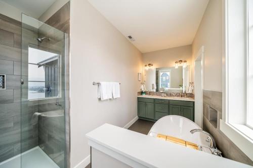 a bathroom with a sink and a shower at Here Comes the Sun #123 in Chelan
