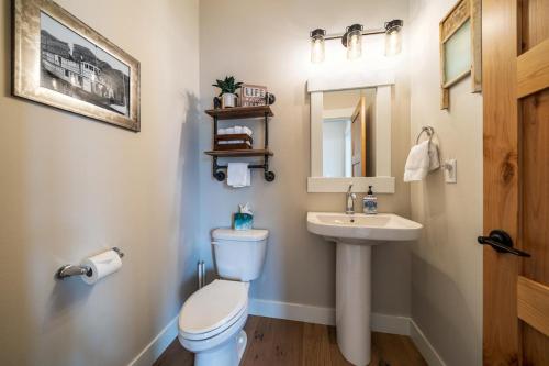 a bathroom with a toilet and a sink at Here Comes the Sun #123 in Chelan