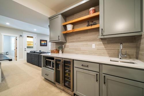 a kitchen with a sink and a counter top at Here Comes the Sun #123 in Chelan