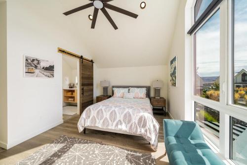 a bedroom with a bed and a large window at Glamping at the Lake #310 in Chelan