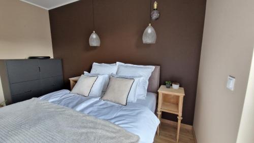 Posteľ alebo postele v izbe v ubytovaní Apartament My City