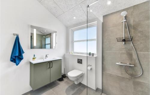 a bathroom with a shower and a toilet and a sink at Cozy Home In Tarm With Sauna in Tarm