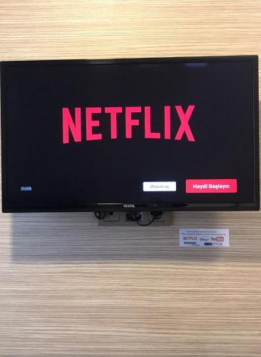 a television with a netflix sign on the screen at Endless Comfort Hotel Taksim in Istanbul