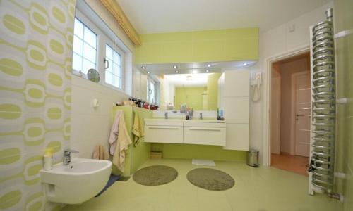 a bathroom with a sink and a toilet and a mirror at Holiday Home Uma in Visoko