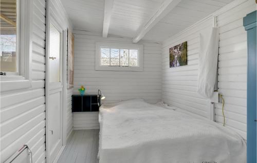 a small white room with a bed in it at 3 Bedroom Cozy Home In Martofte in Martofte
