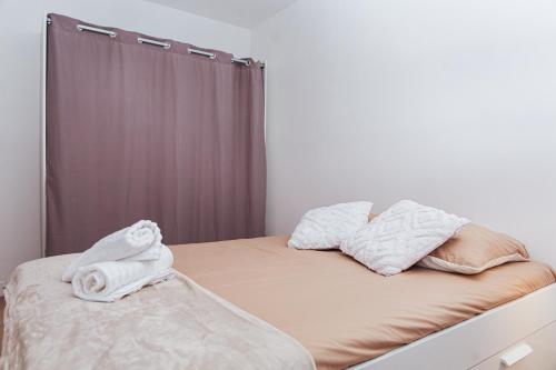 Een bed of bedden in een kamer bij Havre de paix