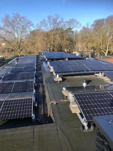 a row of solar panels on top of a roof at Stayokay Hostel Maastricht in Maastricht