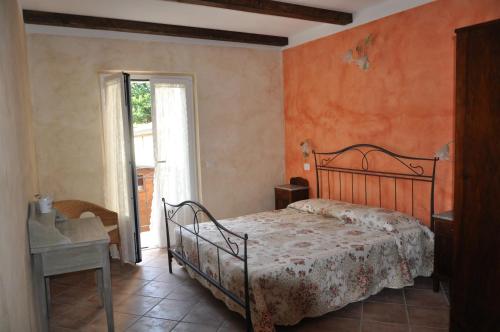 Postel nebo postele na pokoji v ubytování B&B Il Feriolo