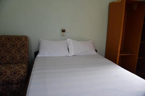 Ένα ή περισσότερα κρεβάτια σε δωμάτιο στο Raffin Royal Lodge