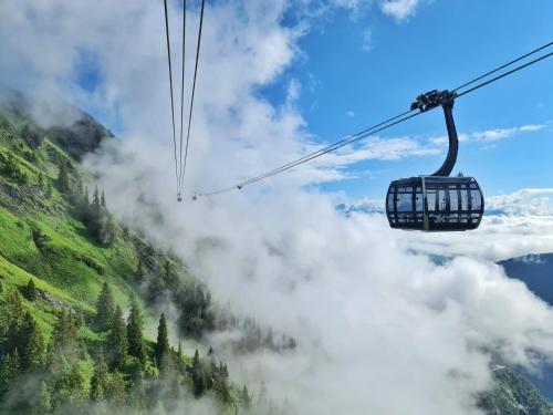 a gondola ride in the mountains above the clouds at AlpenParks Chalet & Apartment Steve Lodge Viehhofen in Viehhofen