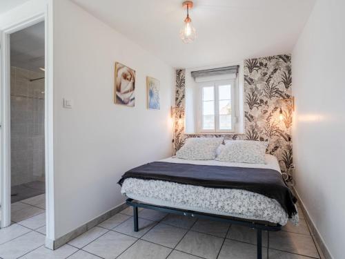 a bedroom with a bed and a shower at Holiday Home L'oyat by Interhome in Pirou
