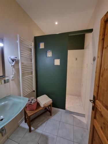 a bathroom with a shower and a sink and a tub at Ferme de l'Abbaye in Dury