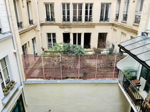 a view of a building from the top of a balcony at STUDIO Retro MARAIS- Paris Center in Paris