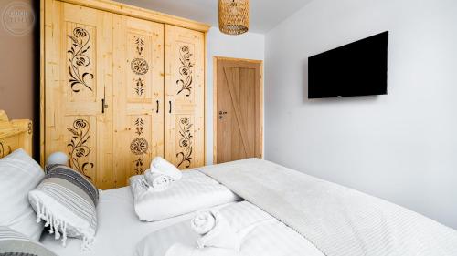Un pat sau paturi într-o cameră la Apartamenty Good Time- Stone Hill IV - Góraleczka 8c33