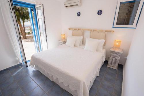 Postel nebo postele na pokoji v ubytování Kaiya Villas