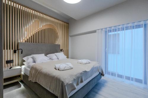 Postel nebo postele na pokoji v ubytování Resort Hevenia Rewal 8