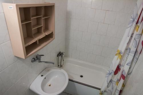 a bathroom with a sink and a bath tub at Apartments Kolej Vltava in Prague