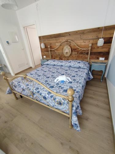 Una cama o camas en una habitación de Granchio Blu House - Casa Vacanze Lido di Sottomarina