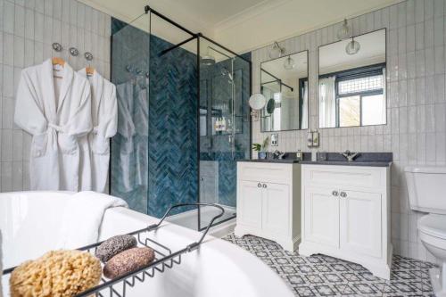 a bathroom with a shower and a toilet and a sink at The Crown Inn in Bromley