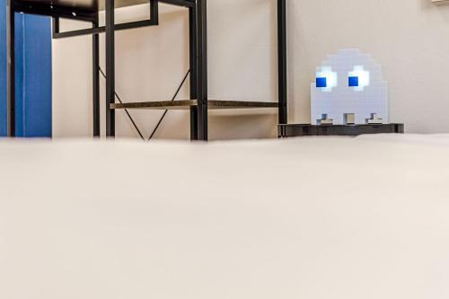 a view of a room with a table and a mirror at Game Rooms Experience in Livorno