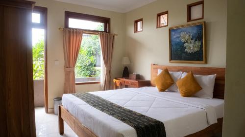 Postel nebo postele na pokoji v ubytování Satya House Ubud