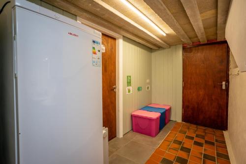 a hallway with a door and a stool in a room at Skylark View, Most Stunning Views over Matlock. in Matlock
