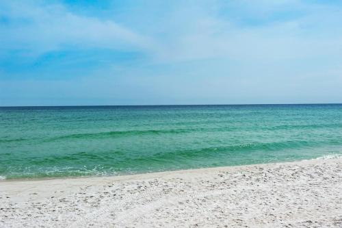 a sandy beach with the ocean in the background at Dream Maker in Navarre