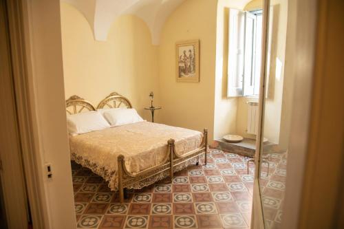 Tempat tidur dalam kamar di B&B Palazzo Lombardi