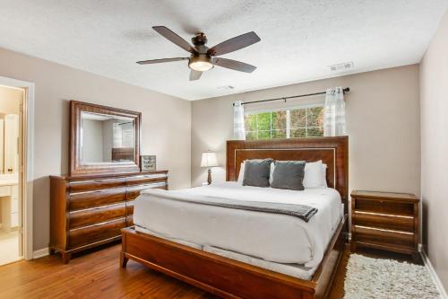 a bedroom with a bed and a ceiling fan at Spirit Island Home in Savannah