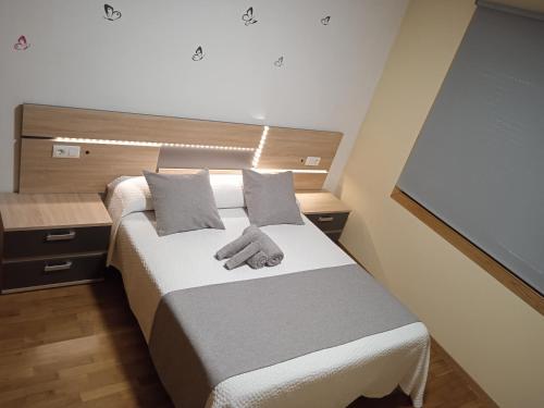 Katil atau katil-katil dalam bilik di Apartamento Mirabel