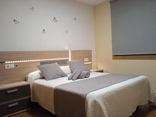 Katil atau katil-katil dalam bilik di Apartamento Mirabel