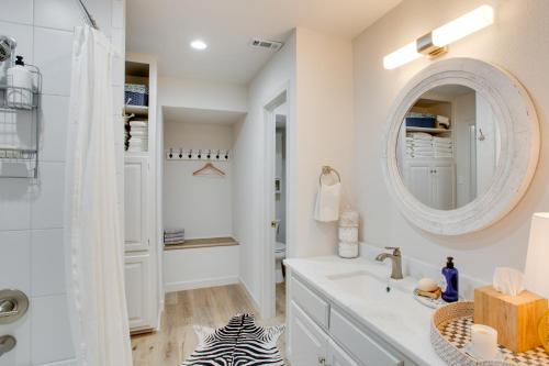 a bathroom with a sink and a mirror at Vacation Rental at Lake Texoma, quarter Mi Away! in Pottsboro