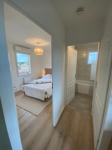 Ένα ή περισσότερα κρεβάτια σε δωμάτιο στο Appartement cosy, vue imprenable