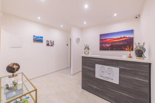 a gallery with a display case in a room at I Mori dell’Etna in Giardini Naxos