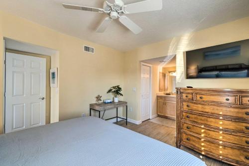a bedroom with a bed and a ceiling fan at Waterfront Nokomis Condo Less Than Half Mile to Beach! in Nokomis