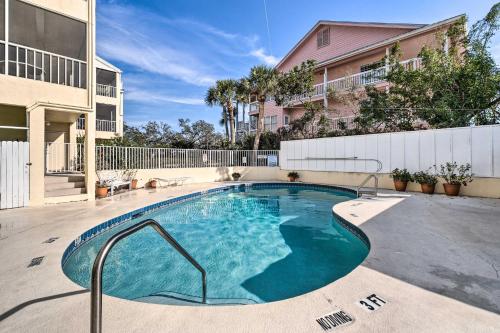 a swimming pool in the middle of a building at Waterfront Nokomis Condo Less Than Half Mile to Beach! in Nokomis