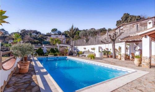 a swimming pool in the backyard of a house at Casa La Serena in Iznájar