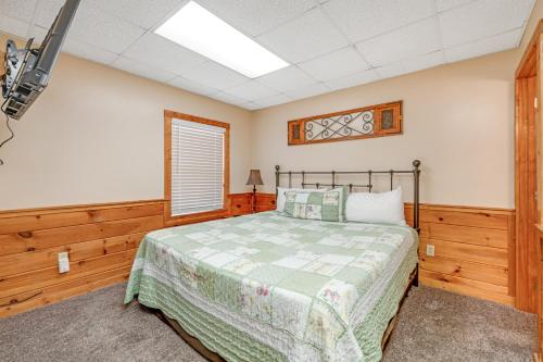 a bedroom with a bed and a skylight at Wildwood in Pigeon Forge